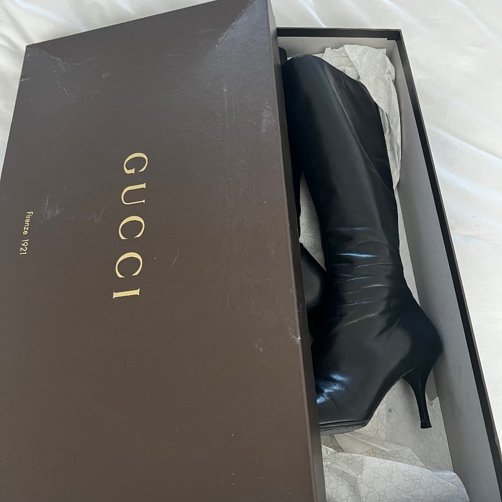 Tall black Gucci boots